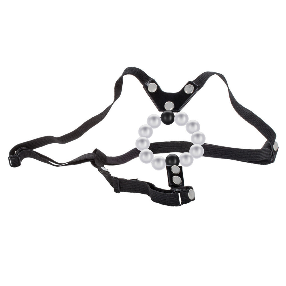 Black harness with pearl-like beads on a white background