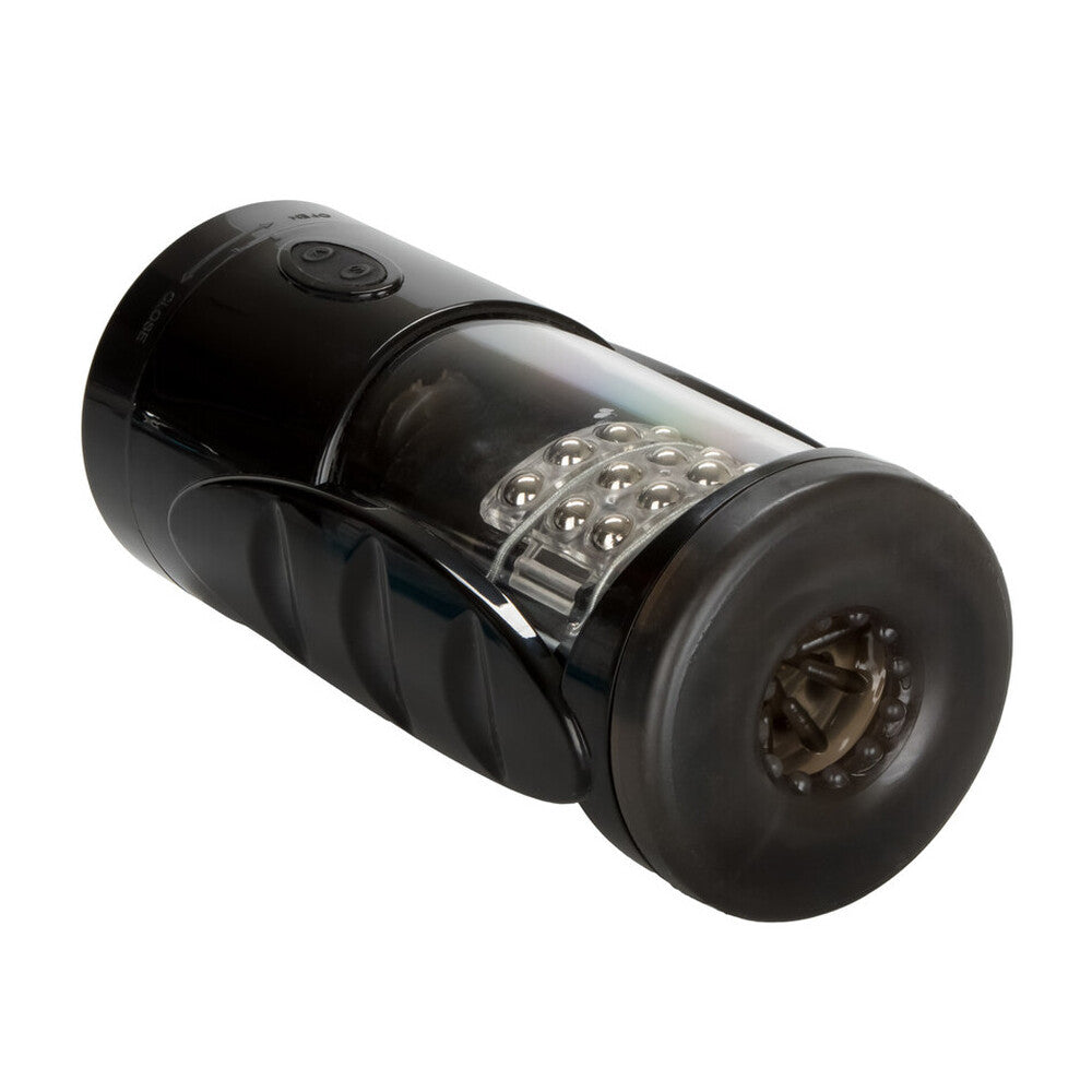 Black cylindrical device with a clear center on a white background