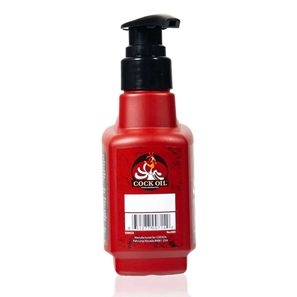 Red lubricant bottle with black pump labeled 'Cock Oil' on a white background