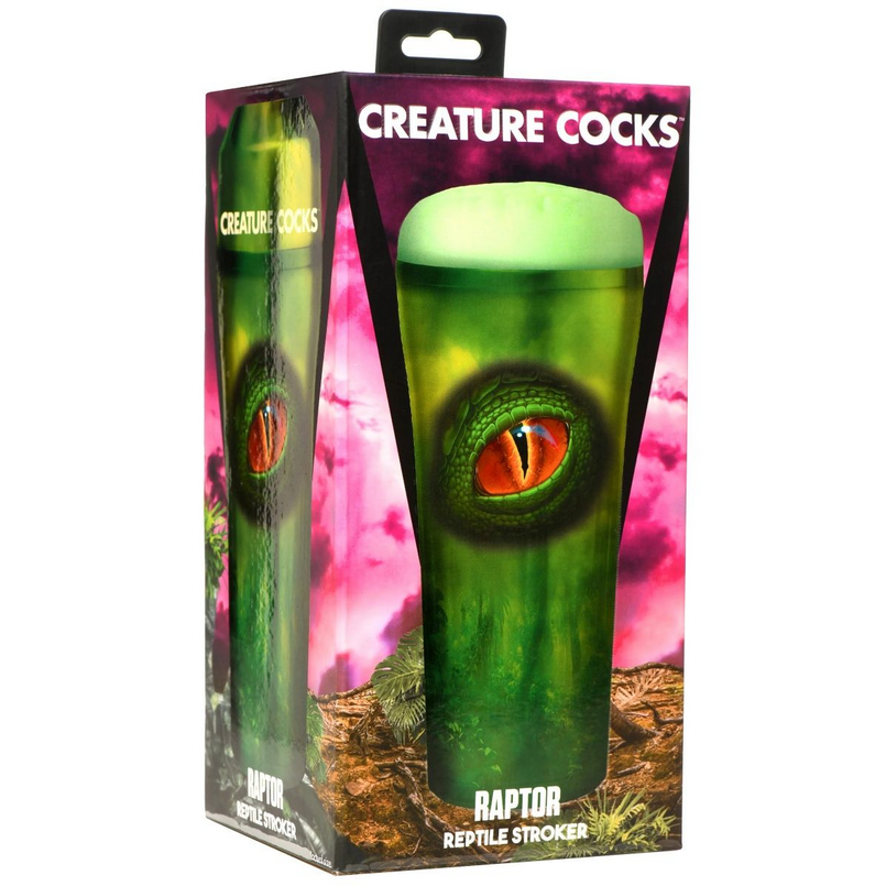 Pink and green creature cock with eye design in packaging labeled 'Creature Cocks'.