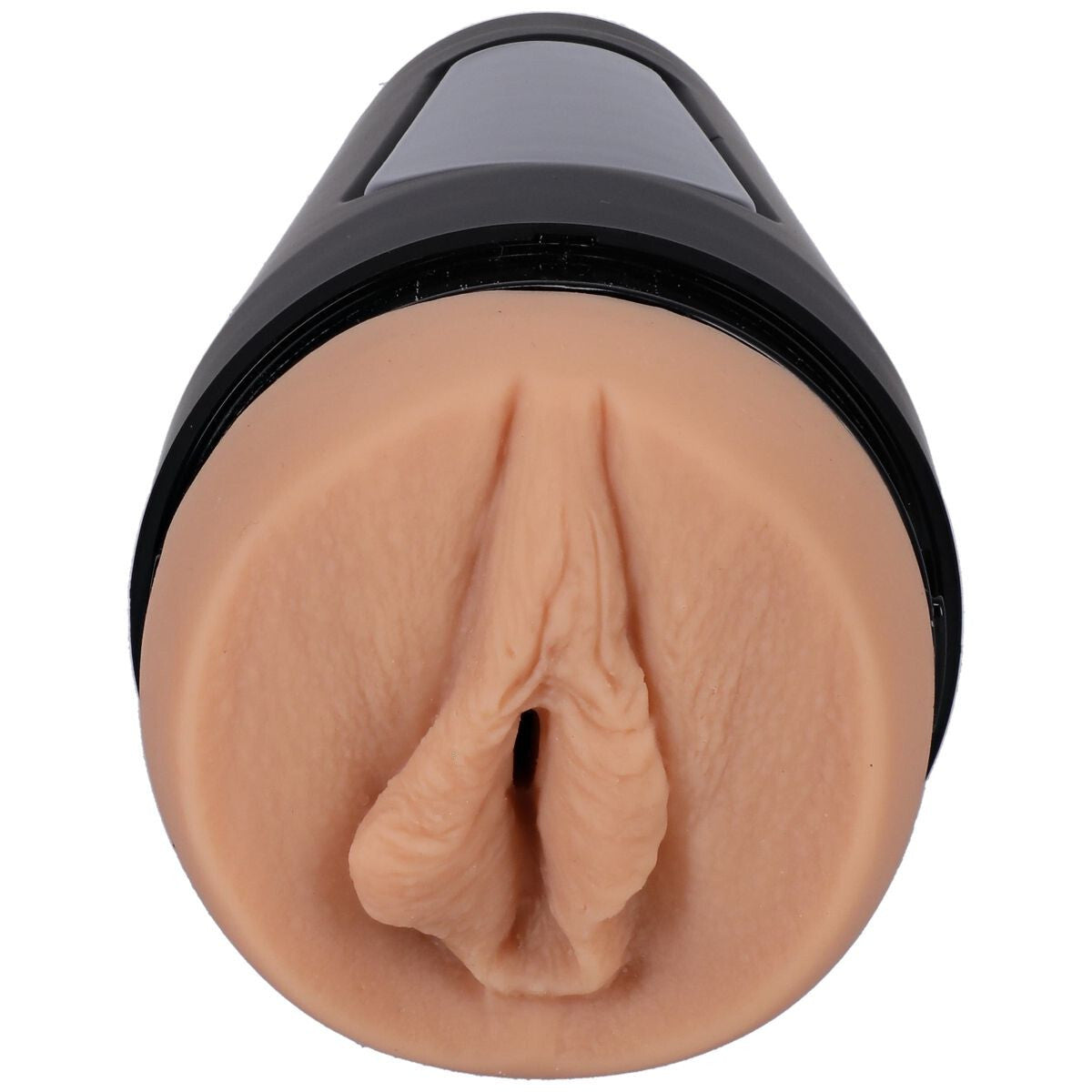 Realistic silicone model of a female genitalia on a white background