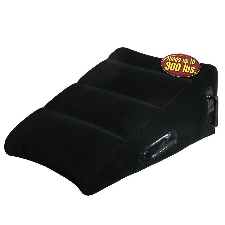 Black wedge-shaped sex pillow with a capacity label on a white background