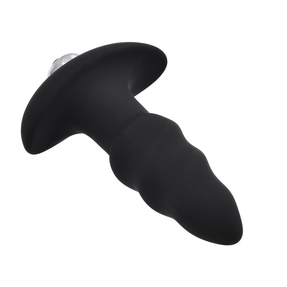Black silicone butt plug on a white background