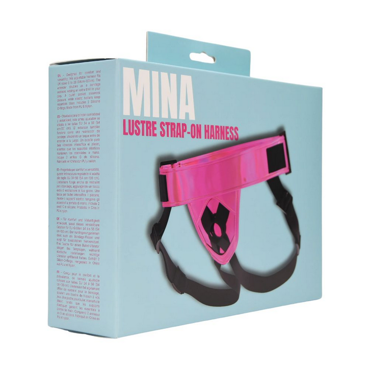 Box packaging of Mina Lustre Strap-On Harness with pink and black design on a light blue background