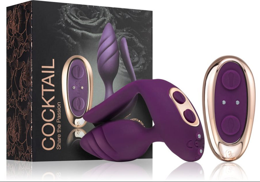 Purple and gold electronic massage device with packaging labelled 'Cocktail' on a white background