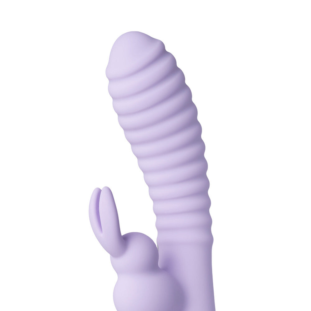 Purple silicone rabbit-shaped sex toy on a white background