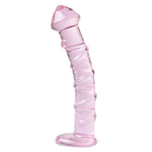 Pink glass dildo on a white background