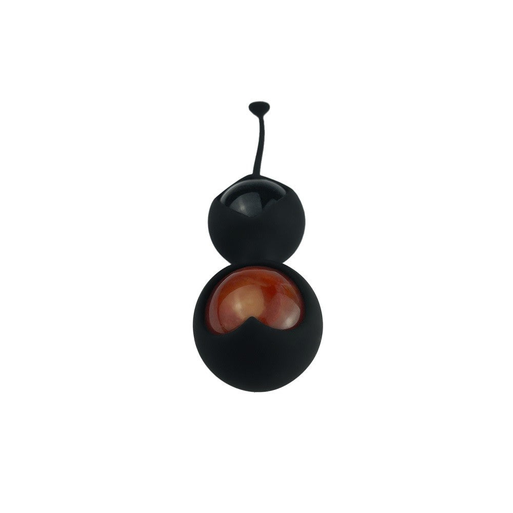 Black and red kegel toy on a white background