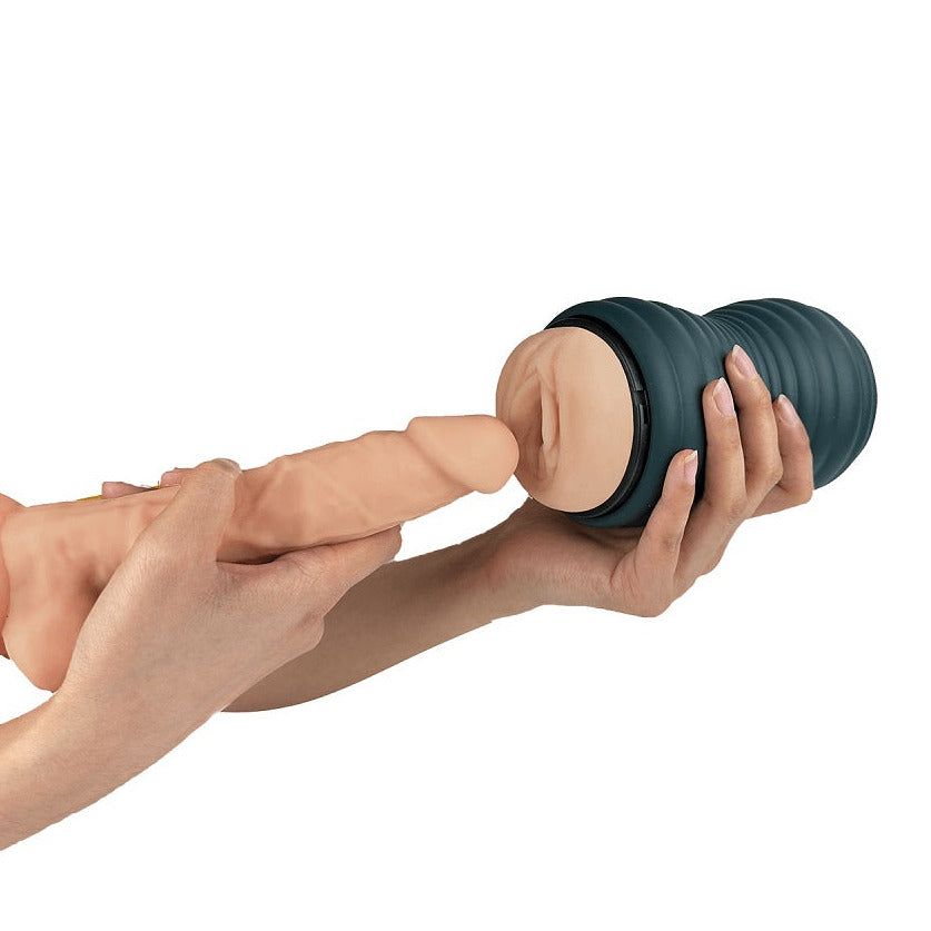 Hand holding a dark blue massager against a white background