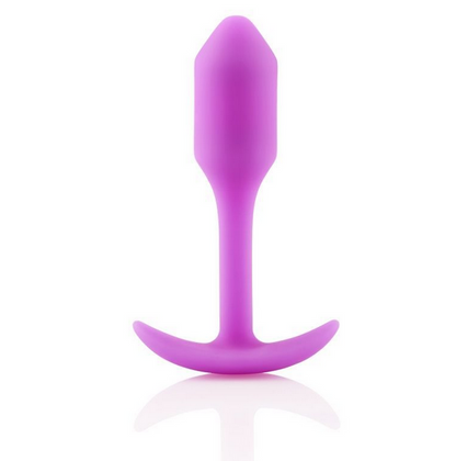 Pink silicone butt plug on a white background