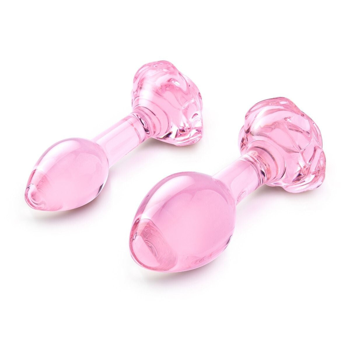 Two pink rose glass butt plugs on a white background