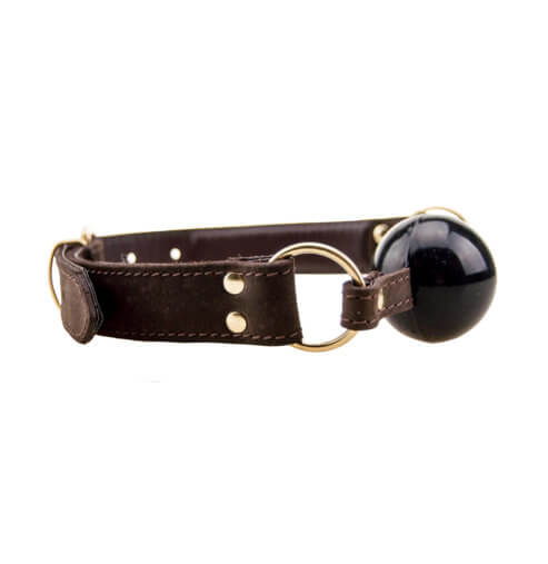 Brown leather collar with a black ball on a white background