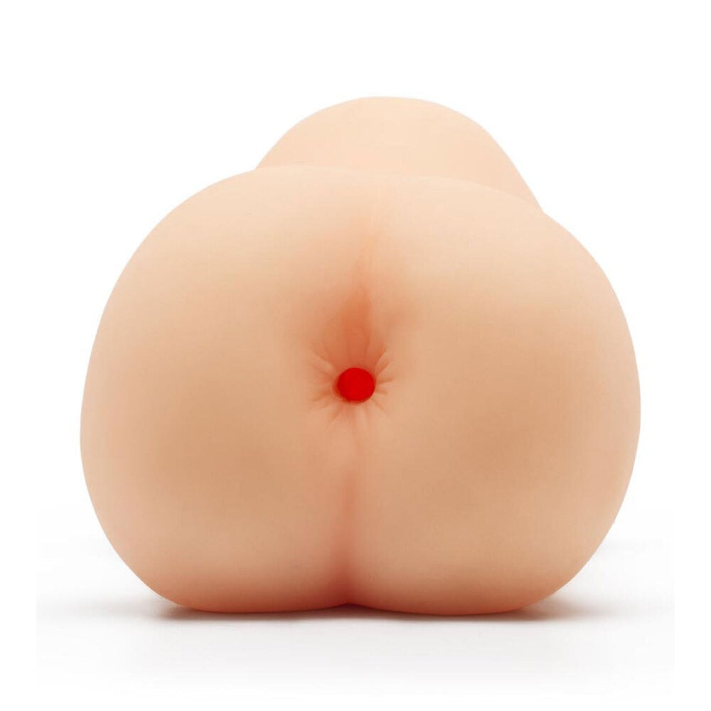 Peach-shaped masturbator with a red center on a white background