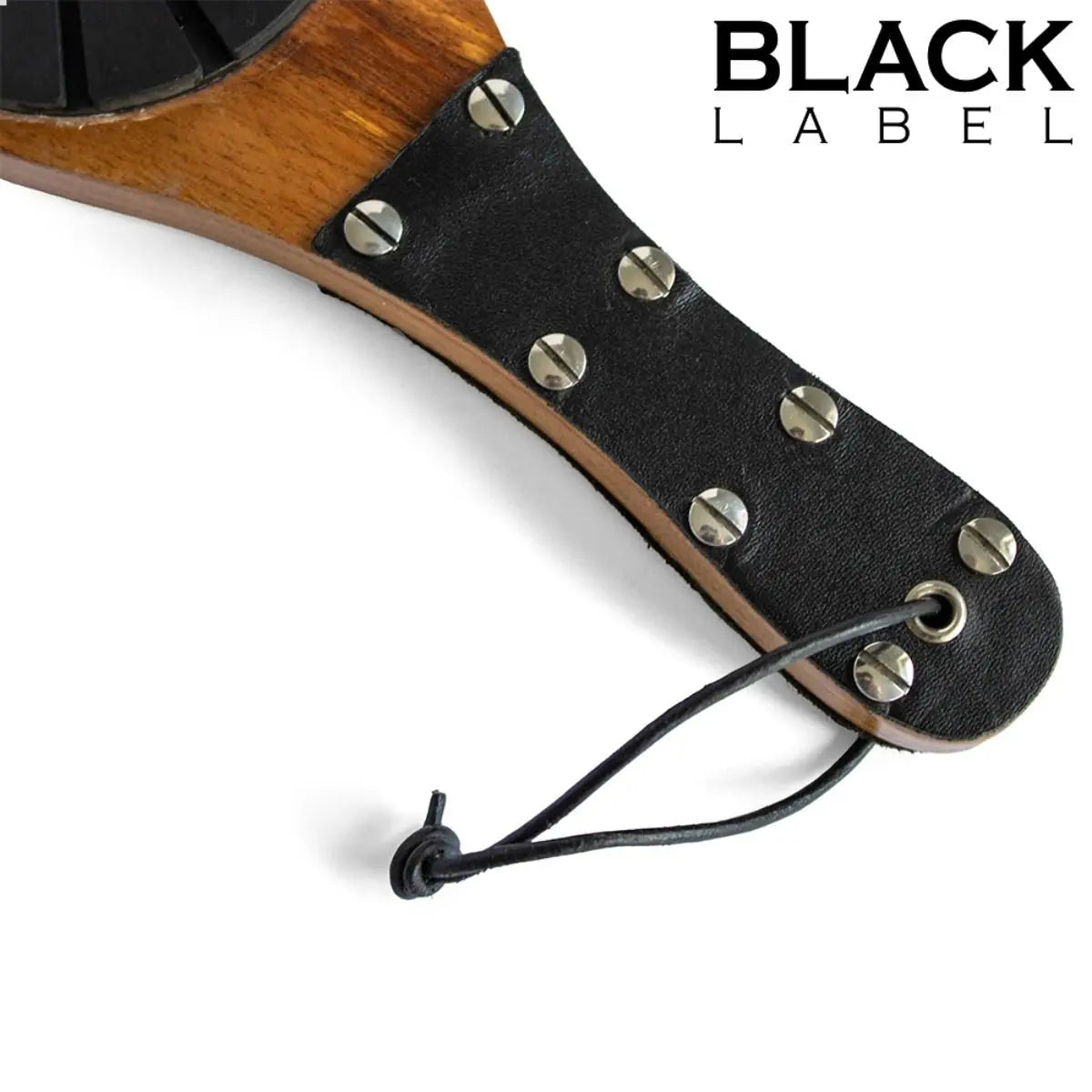 Close-up of a wooden paddle and metal studs on a white background, featuring 'Black Label' branding.