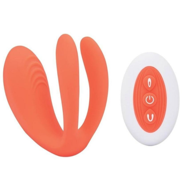 Orange and white vibrator with a circular component on a white background