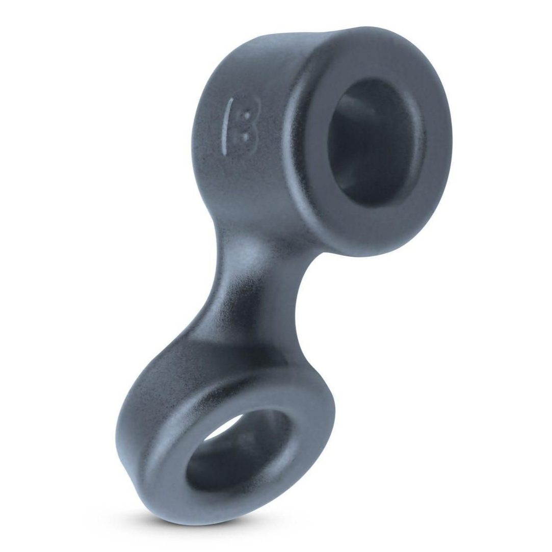 Gray rubber cock and testicle ring with two circular holes on a white background