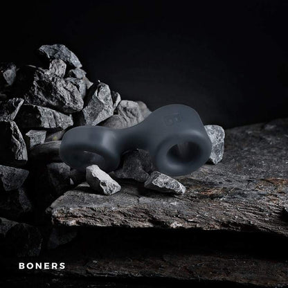 Silicone cock and testicle ring on rocks with 'BONERS' branding