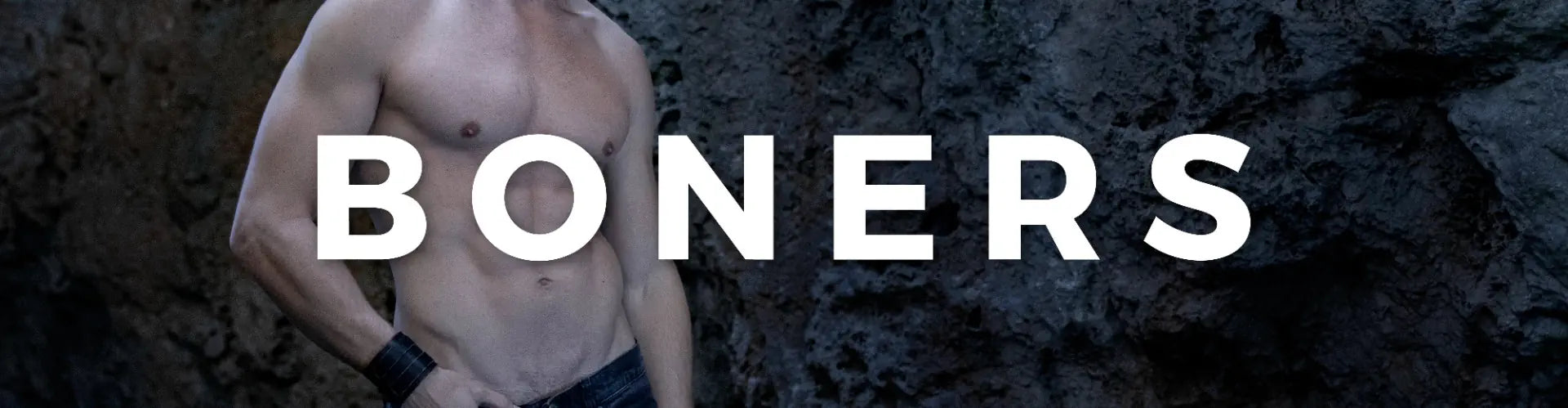 Man standing in front of rocks with 'BONERS' text overlay