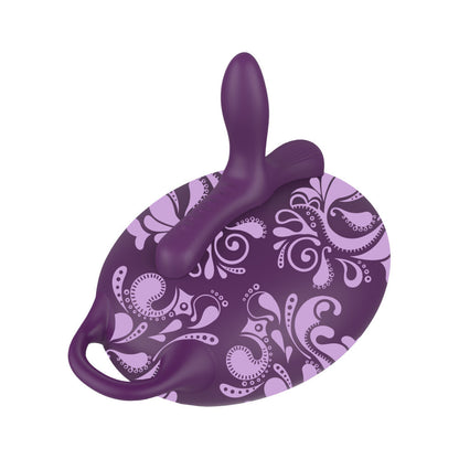 Purple silicone product with paisley pattern on a white background