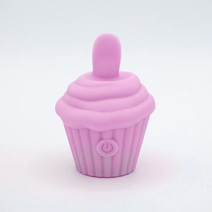 Pink silicone cupcake-shaped vibrator on a light gray background