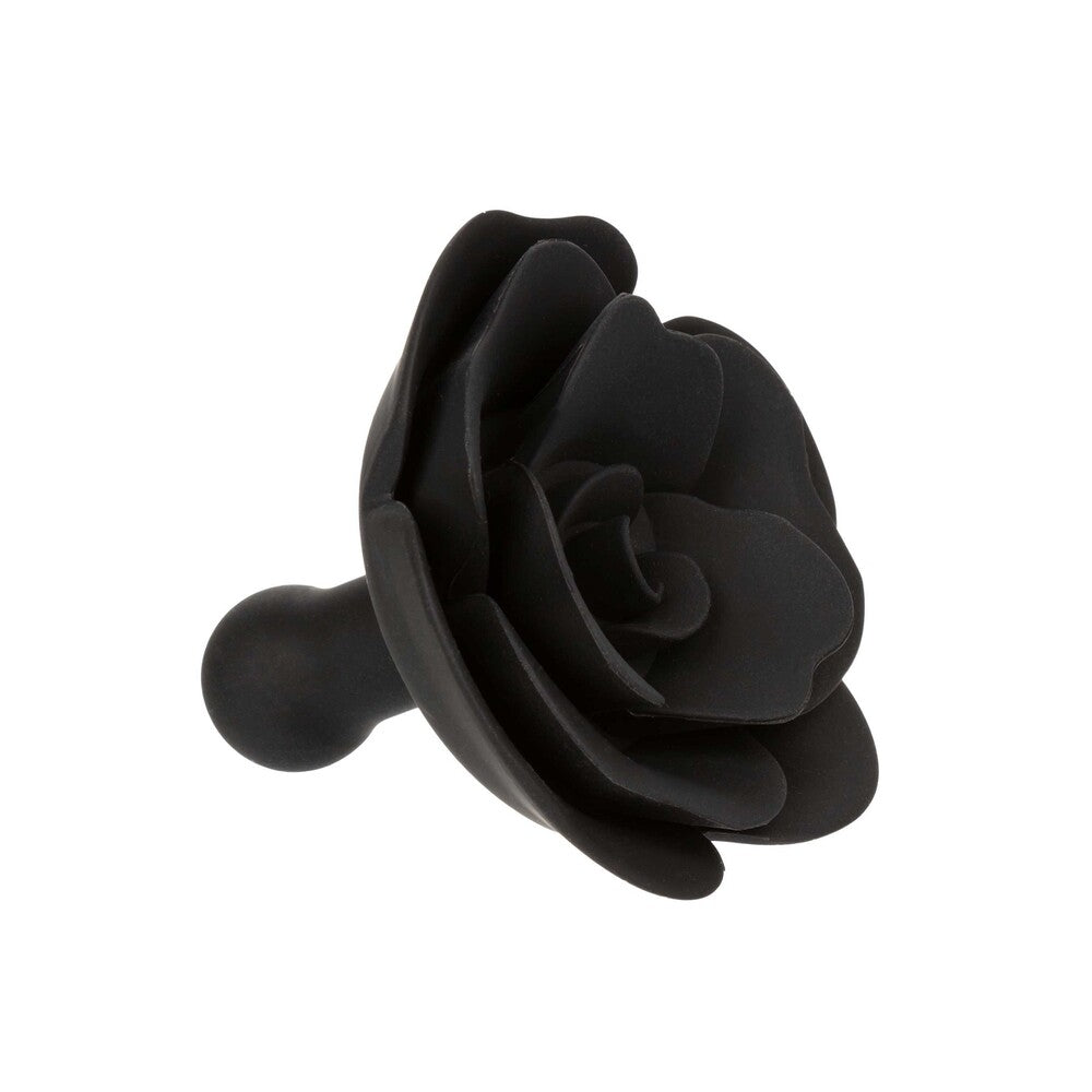 Black rose-shaped object on a white background