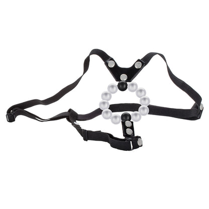 Black harness with pearl-like beads on a white background