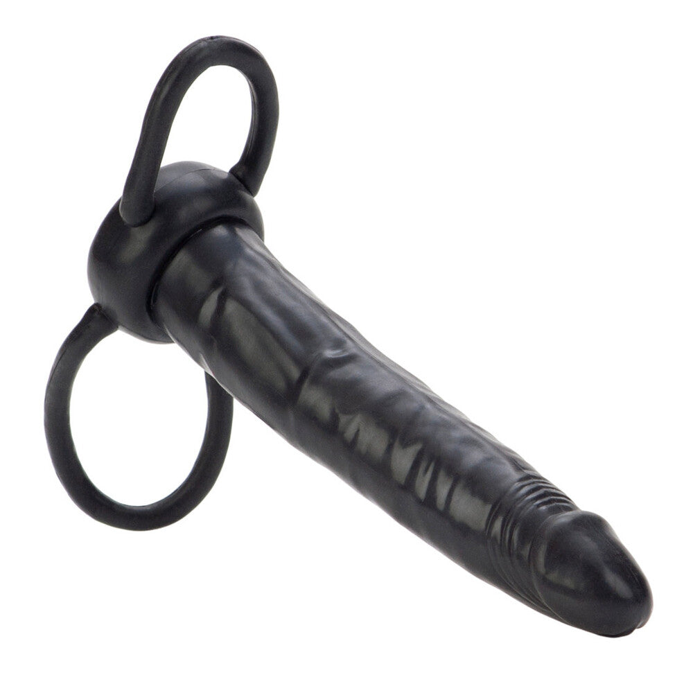 Black rubber strap-on with cock ring on a white background