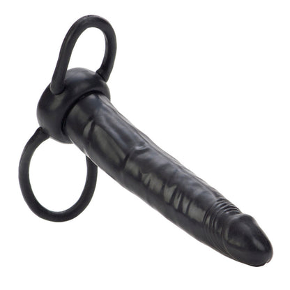 Black rubber strap-on with cock ring on a white background