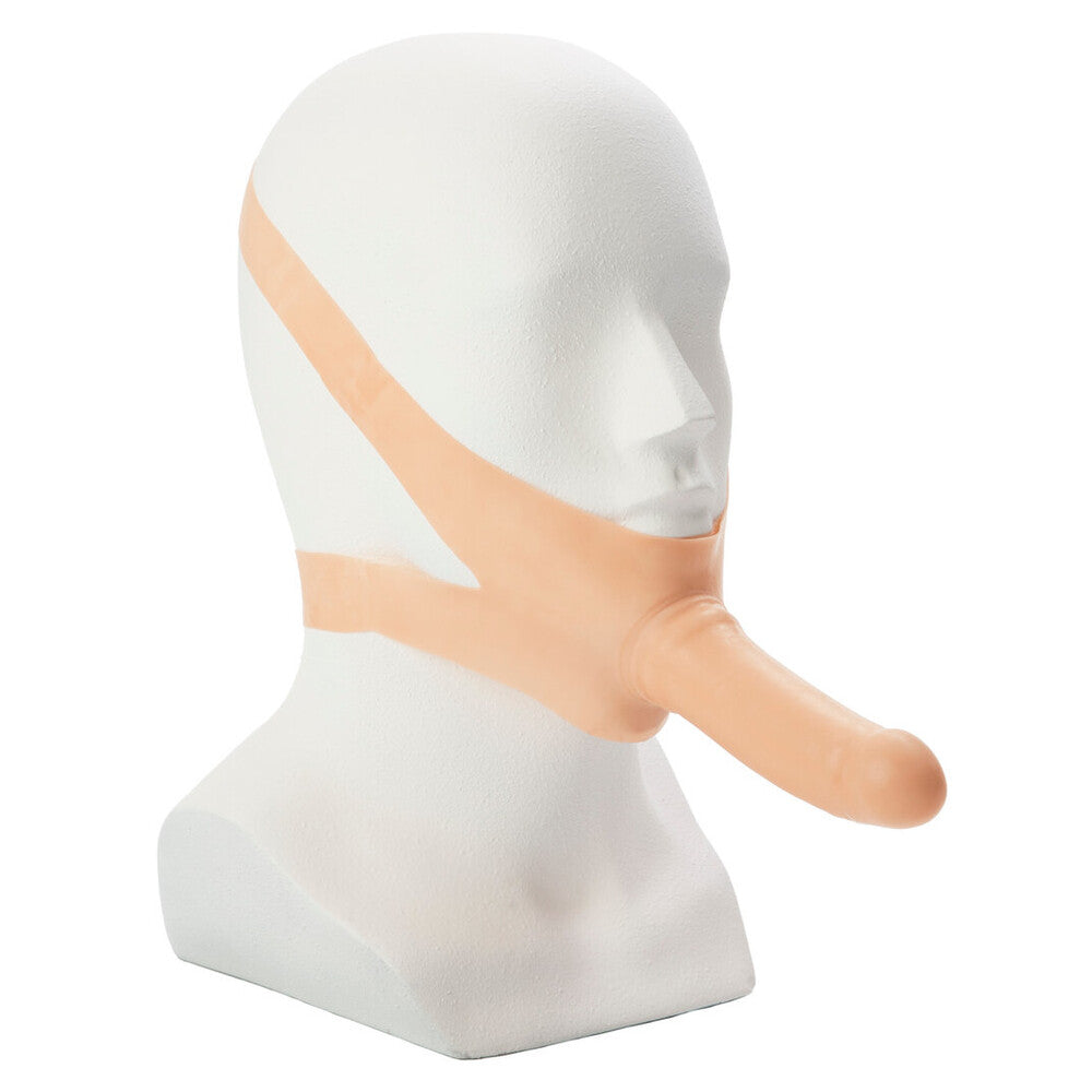 Mouth gag Dildo with a beige strap on a mannequin head against a white background