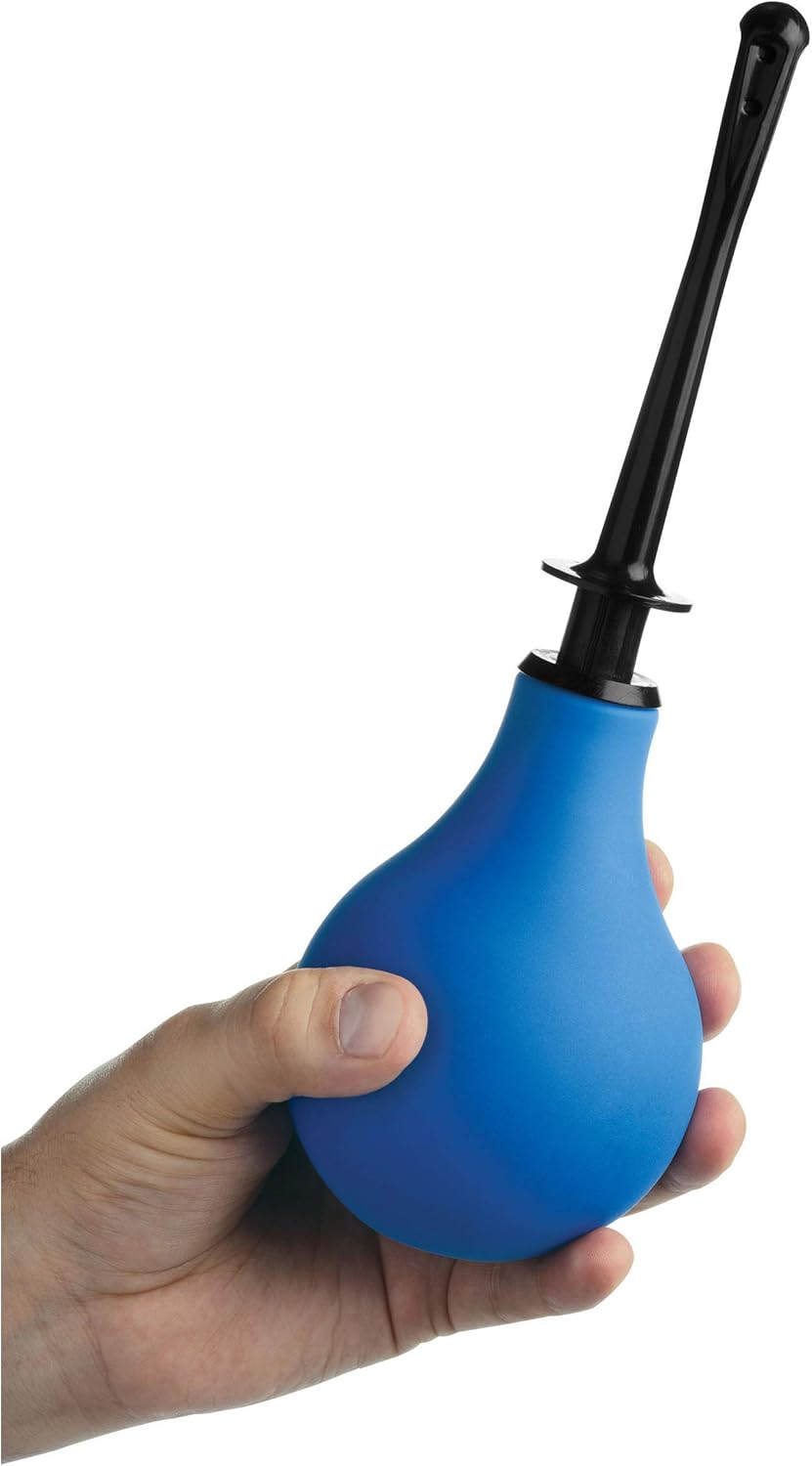 Blue balloon douche pump held by a hand on a white background