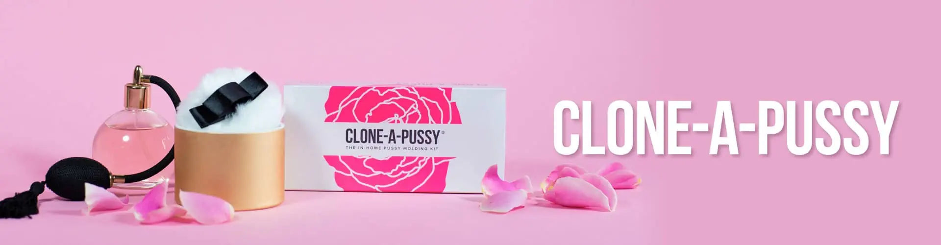 Product with 'Clone-A-Pussy' branding on a pink background