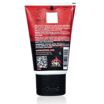 Red and black tube of Cock Oil on a white background