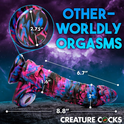 Colorful dildo with measurements against a cosmic background, featuring the brand 'Creature Cocks'.