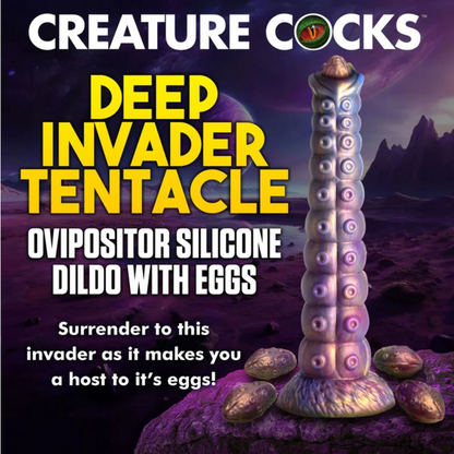 Silicone dildo with tentacle design and text 'Creature Cocks' on a fantasy landscape background.