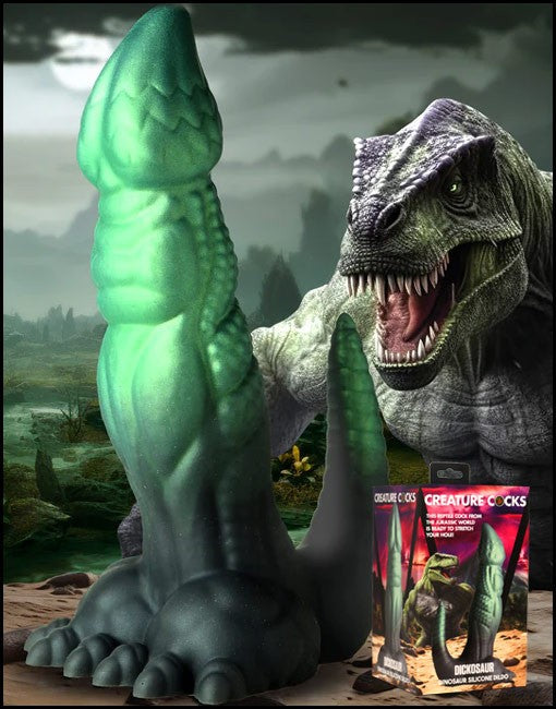 Dino inspired Dildo with a box labeled 'Creature Cocks' in a prehistoric setting.
