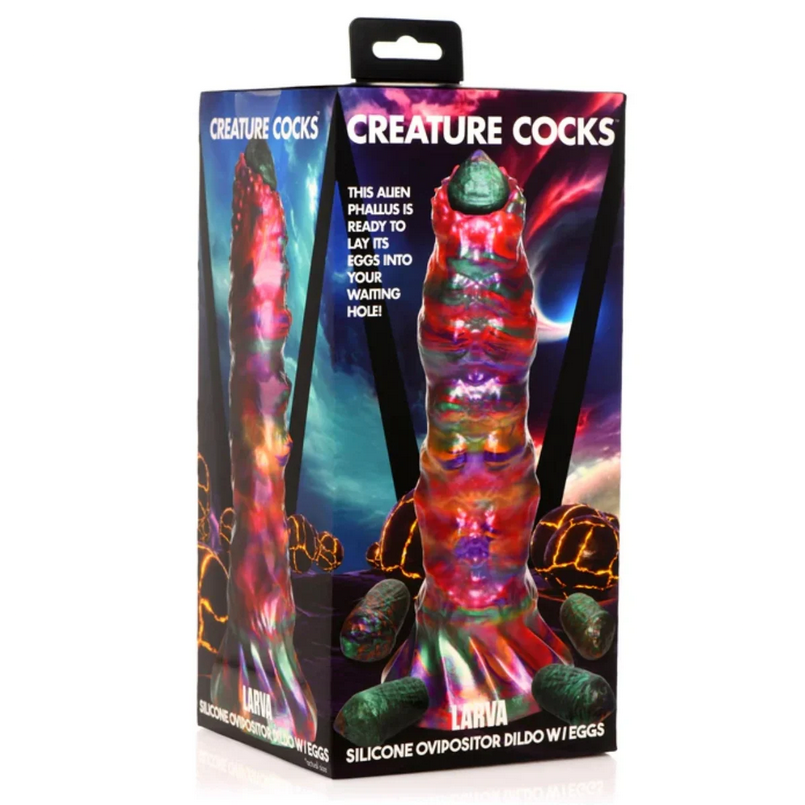 Boxed silicone ovipositor with colorful design and 'Creature Cocks' branding.