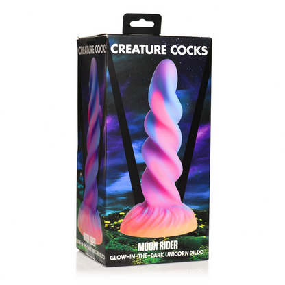Glow-in-the-dark unicorn dildo packaging with 'Creature Cocks' branding on a white background.