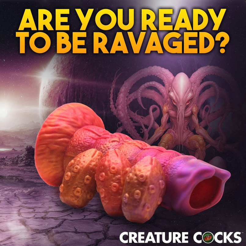Surreal scene with a large, pink, tentacle-like creature on a barren landscape with text 'Are you ready to be ravaged?' and 'Creature Cocks' branding.