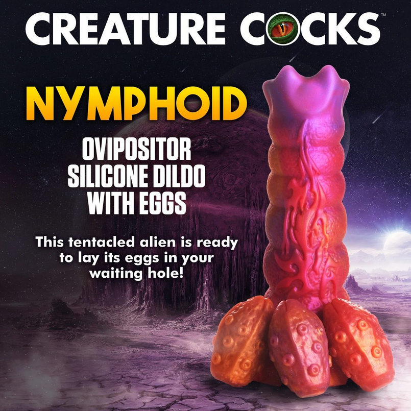 Silicone dildo with alien design on a dark space-themed background, featuring the brand 'Creature Cocks'.