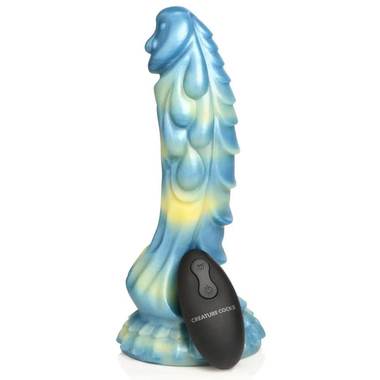 Blue and green seahorse-shaped product with a black remote control on a white background