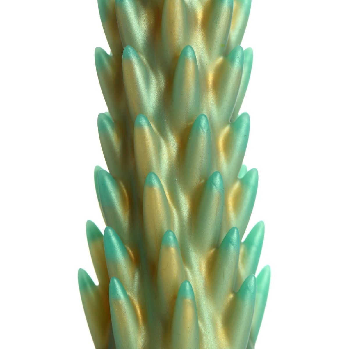 Close-up of a textured green and gold dildo on a white background