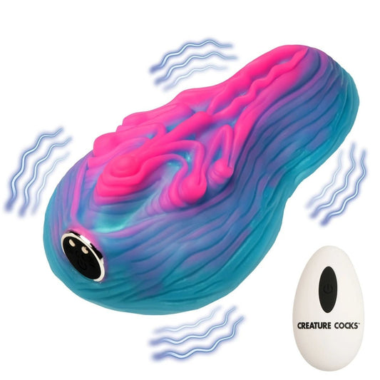 Colorful silicone vibrator with 'Creature Cocks' branding on a white background