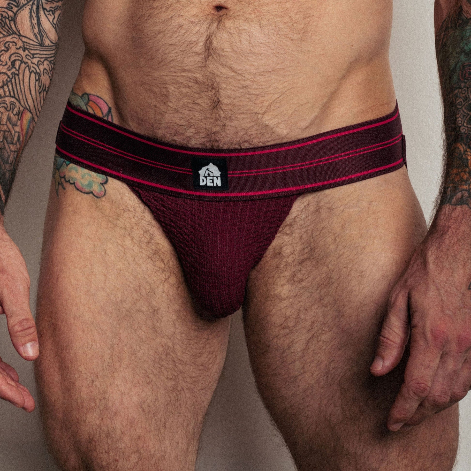 Mens underwear with a visible brand logo on a neutral background