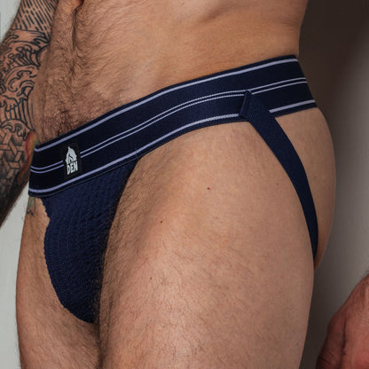 Navy men's underwear with white stripes on a plain background