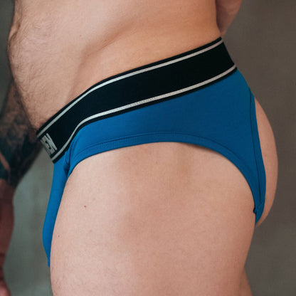 Blue men's underwear with a black waistband on a neutral background