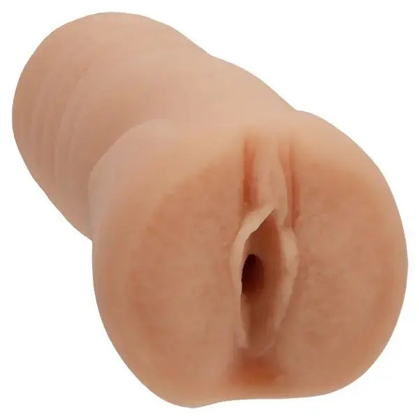 Realistic silicone model of a human vagina on a white background