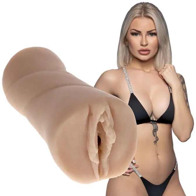 Woman in black lingerie with a close-up of a realistic silicone stroker on a white background