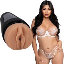 Woman wearing a white lace bra and panties set with a close-up of a black and brown product.