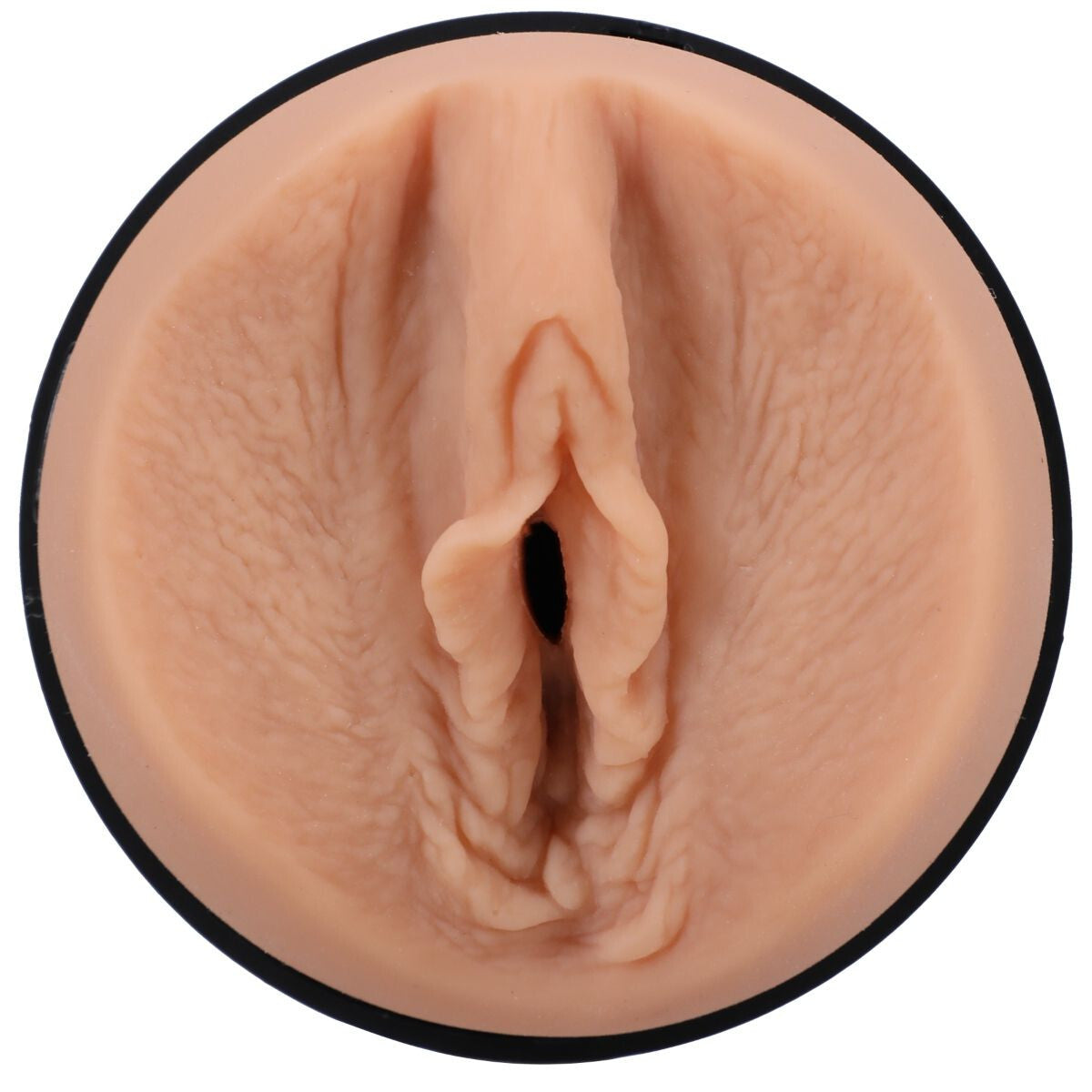 Close-up of a realistic silicone model of a female reproductive organ on a white background