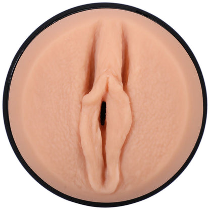 Close-up of a silicone masturbator shaped like a pussy on a white background